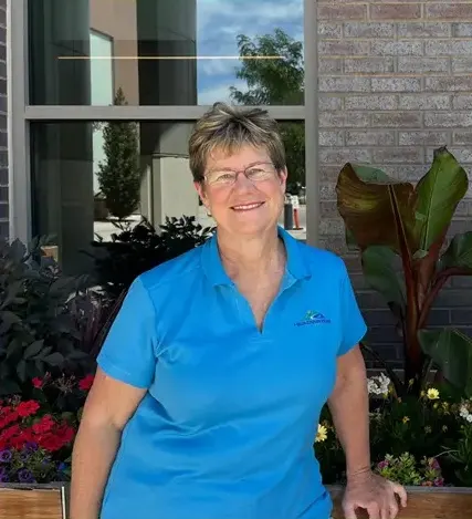 Lisa Asmussen of Headwaters Health and Wealth outside her Brighton, Colorado office